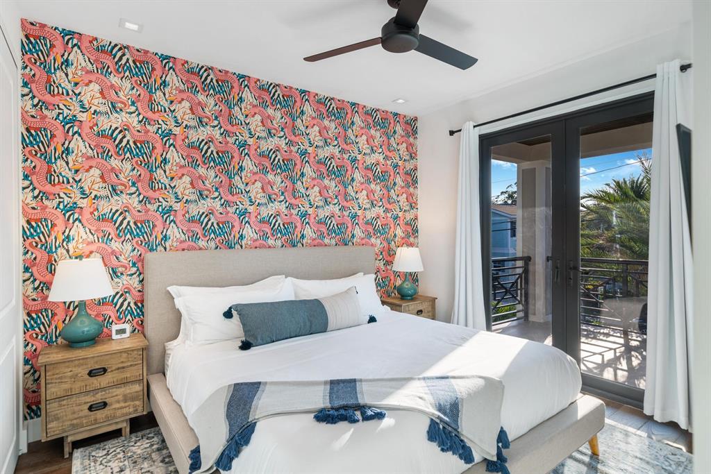 620 Southwest 12th Avenue Fort Lauderdale, FL 33312 - Photo 35 of 49 a bedroom with a bed and a chandelier