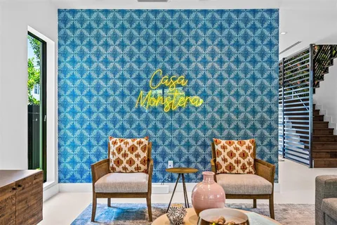 a living room with furniture and a lamp