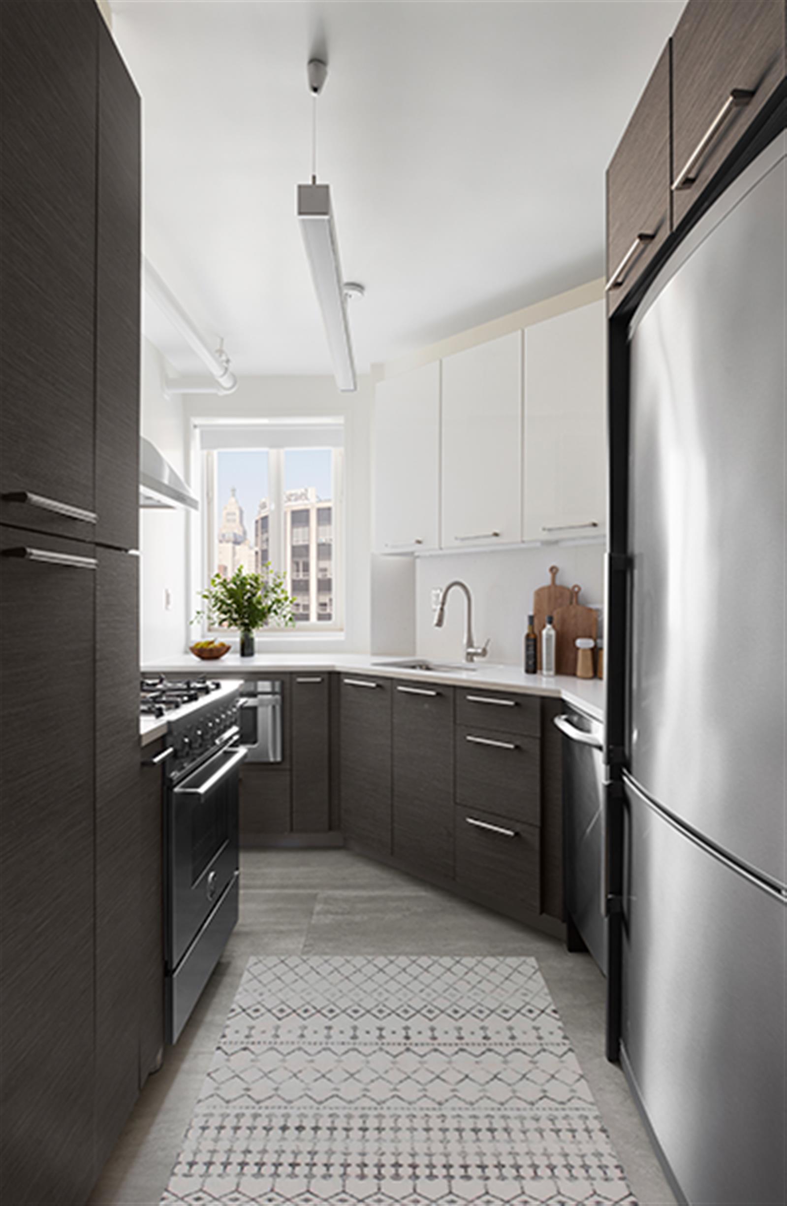 272 1st Avenue, Unit 11A Manhattan, NY 10009 - Photo 3 of 19 a kitchen with a refrigerator a sink and dishwasher
