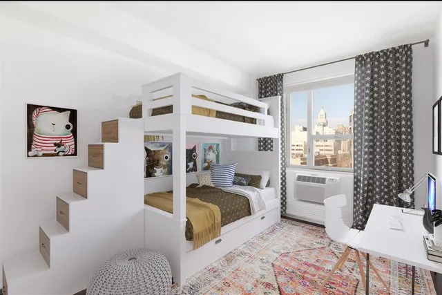 a bedroom with a large bed and a couch