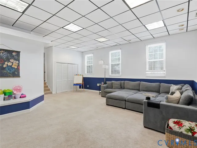 a living room with furniture and window