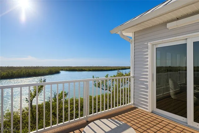 a view of a balcony with wooden floor