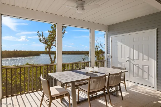 a view of a patio with a table and chairs