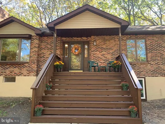 a front view of house with stairs