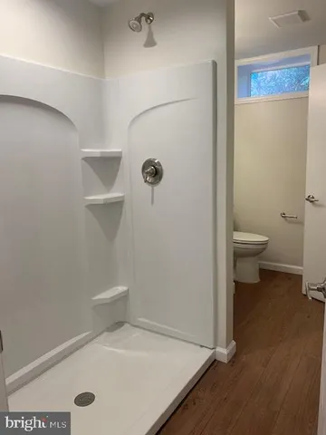 a bathroom with a granite countertop sink