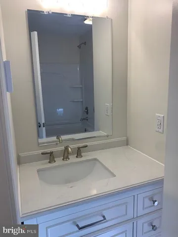 a bathroom with a sink and vanity