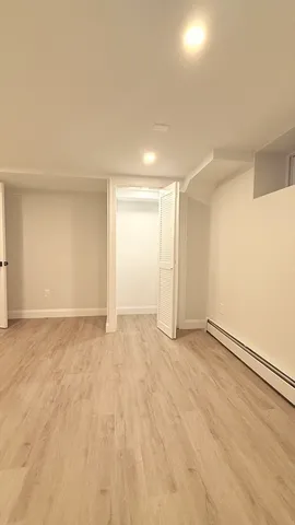 a view of an empty room and a window