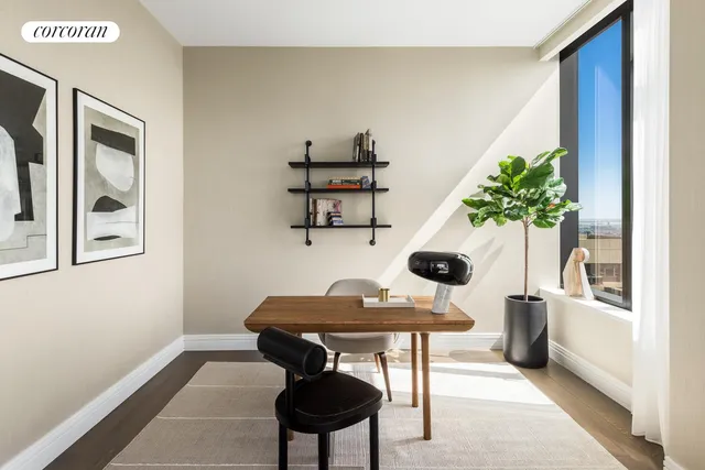 a kitchen with a table chairs refrigerator and cabinets