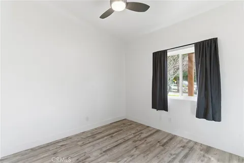 an empty room with windows and entrance