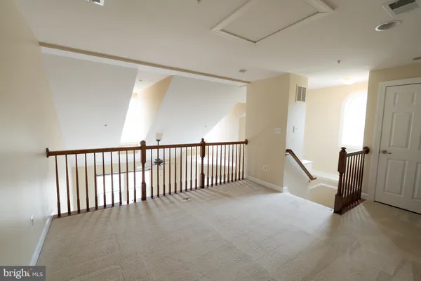 a view of a hallway with workspace