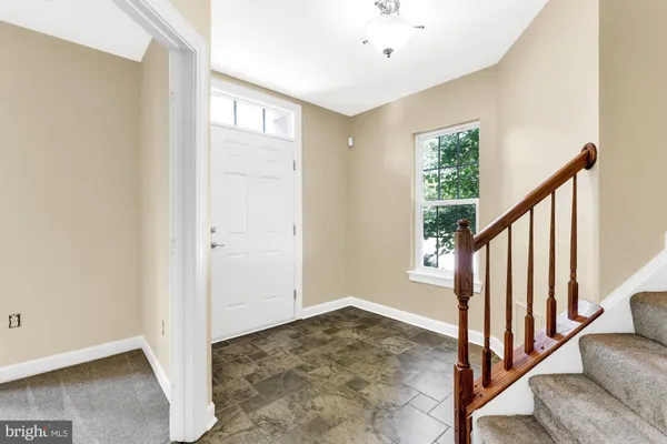 a view of entryway with stairs