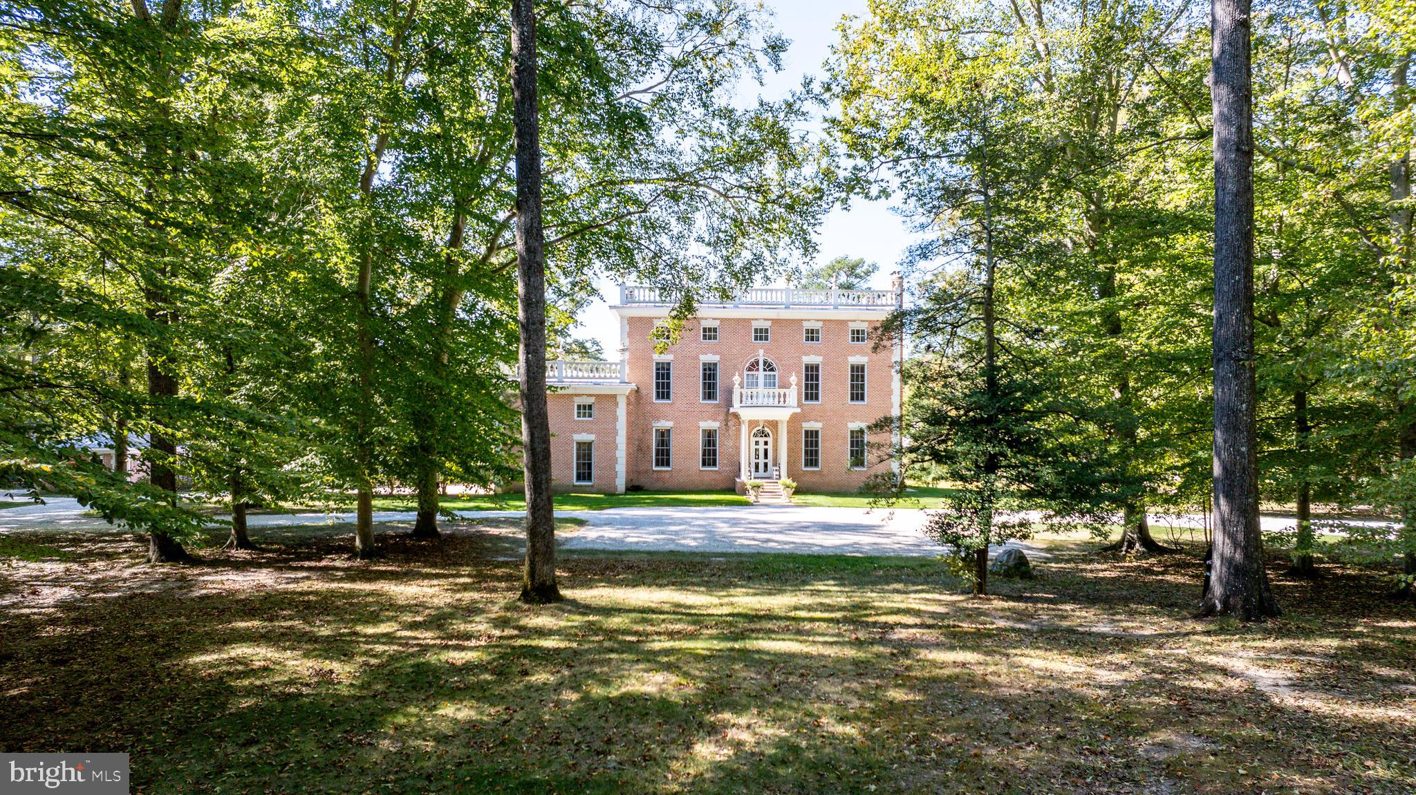 a view of a building with a large tree