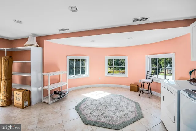 a living room with furniture and window