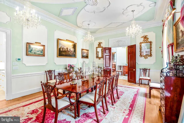 a view of a dining room with furniture and a rug