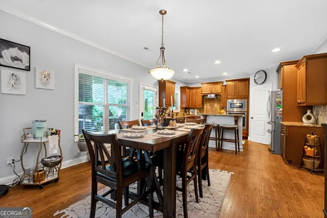 a view of a dining area with furniture window and wooden floor