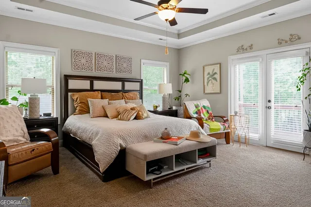 a bed room with a bed and a chandelier