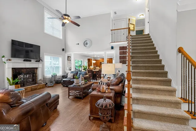 a living room with furniture fireplace and a flat screen tv