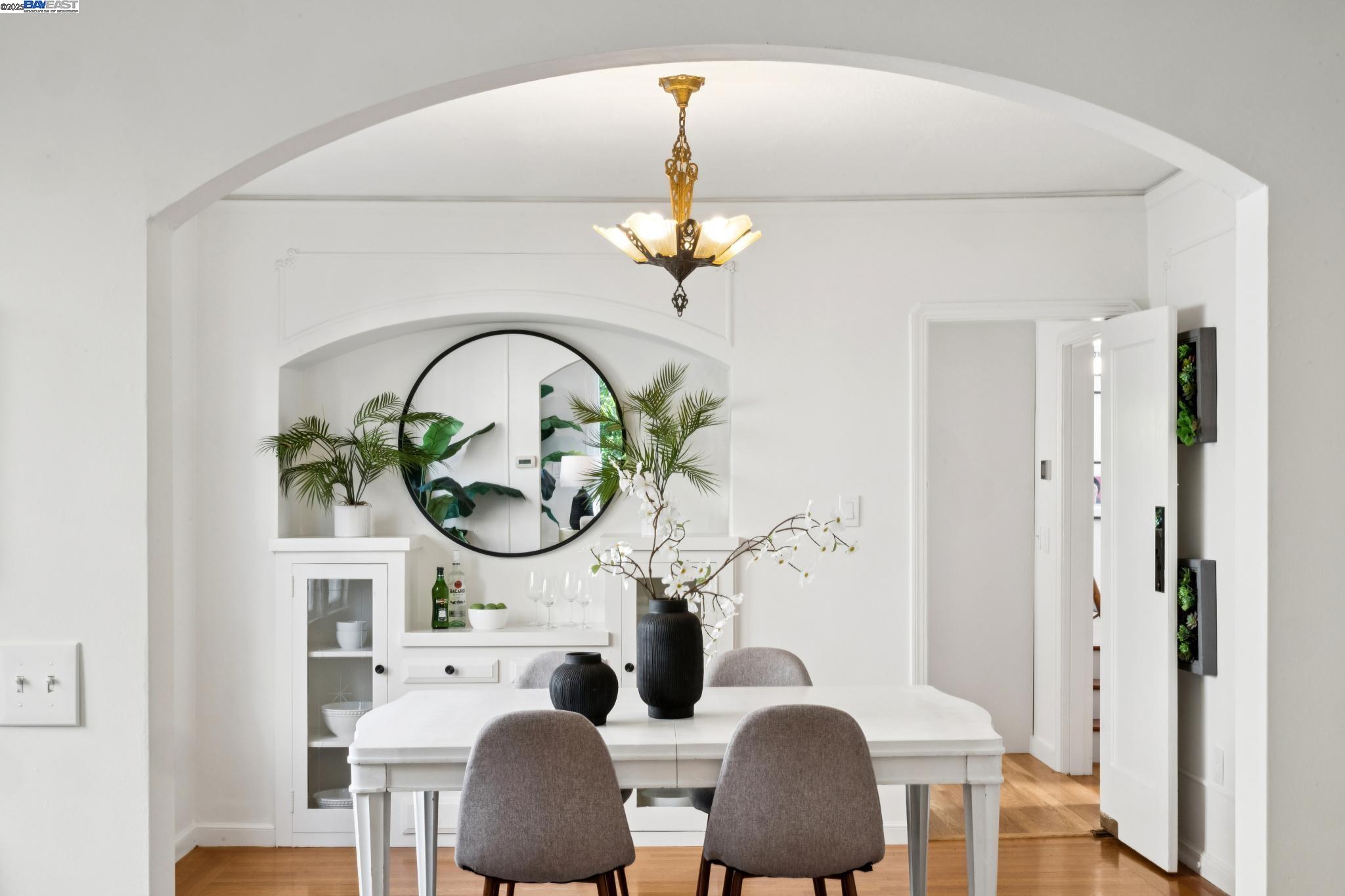 3047 Halcyon Court Berkeley, CA 94705 - Photo 13 of 45 a view of a dining room with furniture a potted plant and wooden floor