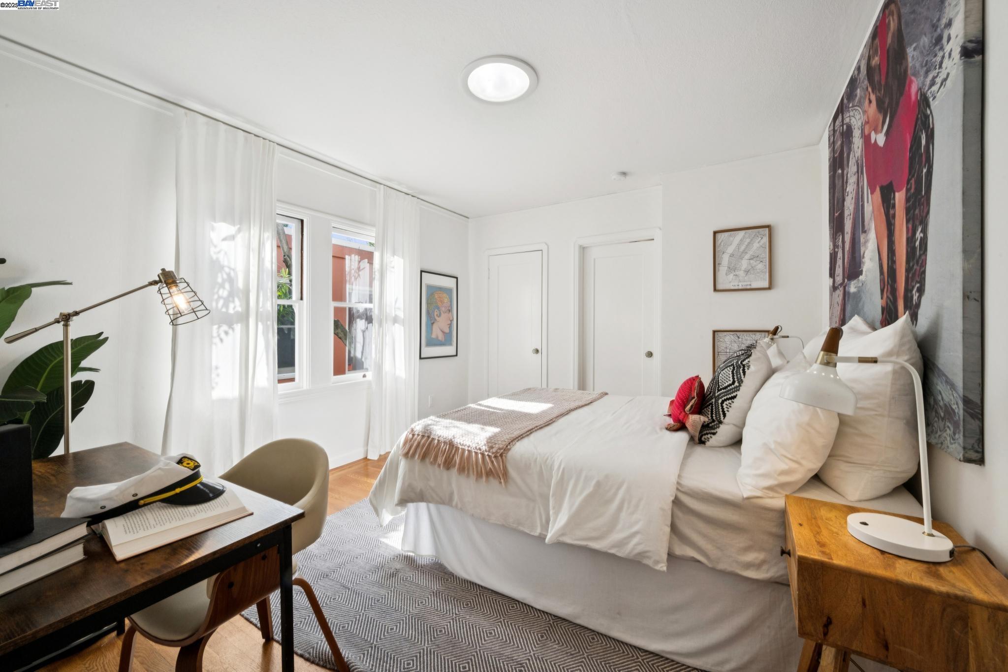 3047 Halcyon Court Berkeley, CA 94705 - Photo 29 of 45 a bedroom with a bed and a flat screen tv