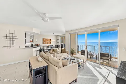 a front view of a building with outdoor space and seating area