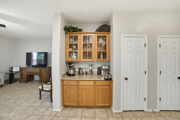 a view of a dining room with furniture and window