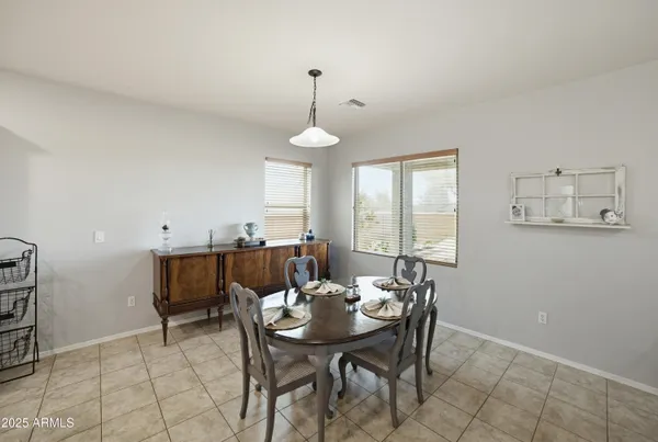 a very nice looking dining room with a table and chairs