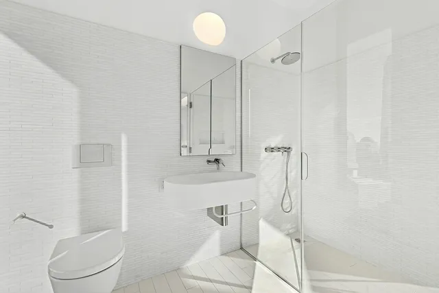 a bedroom with a large bed and a large window