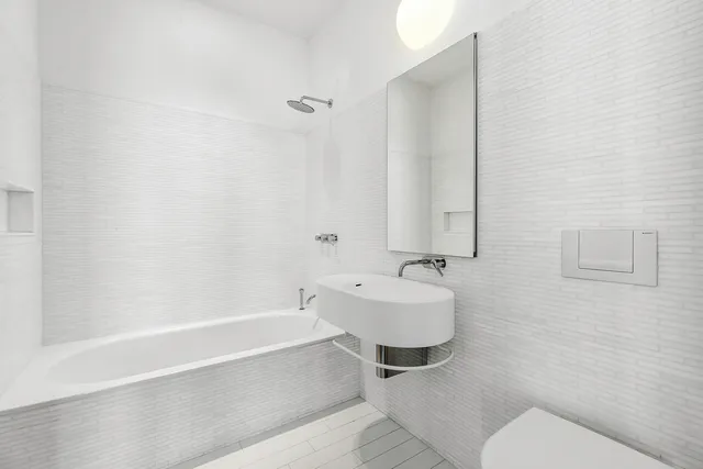 a living room with a table and chairs