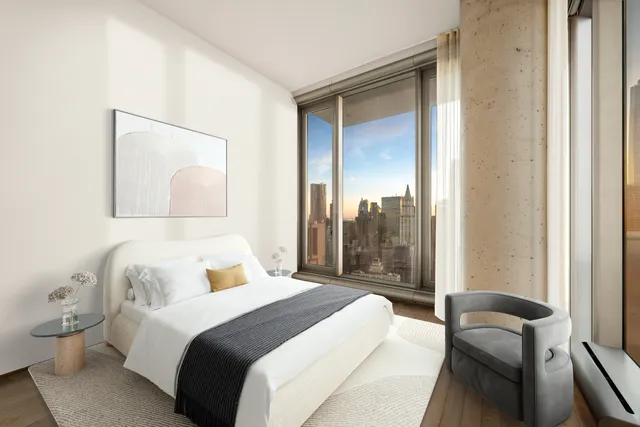 a white bath tub sitting in a bathroom next to a window