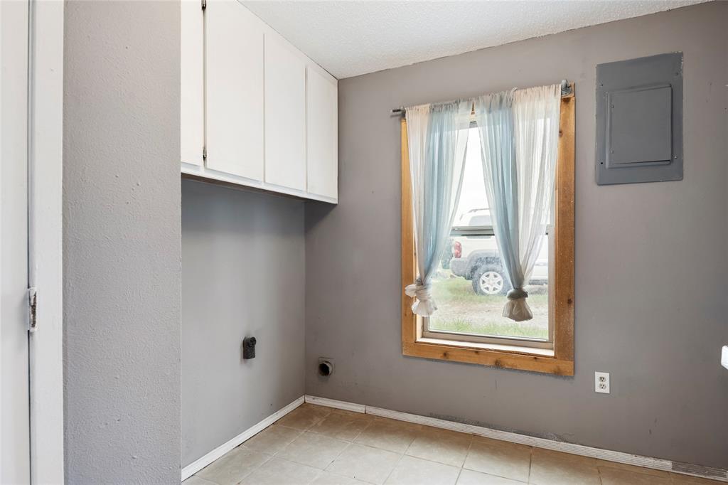 1106 HCR 1414 Covington, TX 76636 - Photo 18 of 37 a view of an empty room with a window