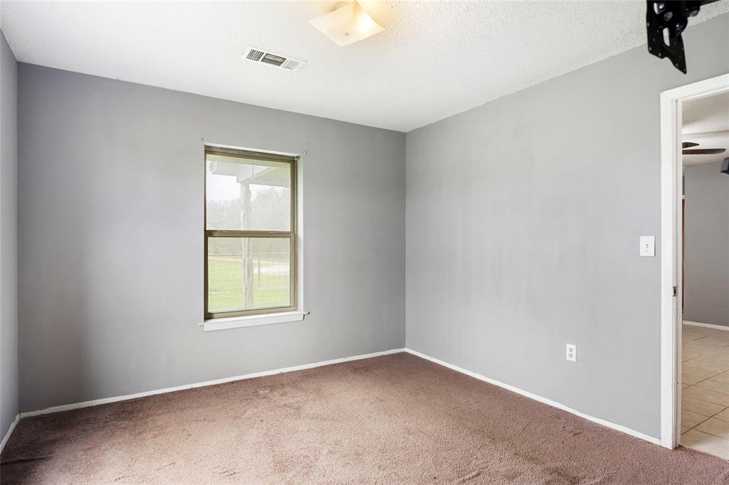 1106 HCR 1414 Covington, TX 76636 - Photo 19 of 37 an empty room with windows