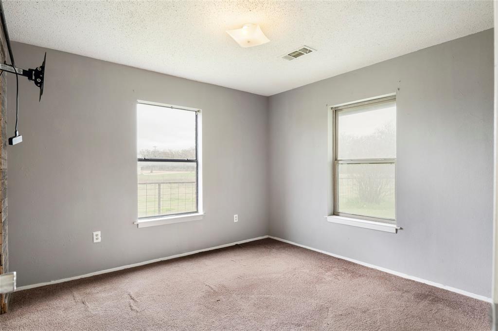 1106 HCR 1414 Covington, TX 76636 - Photo 20 of 37 an empty room with a window