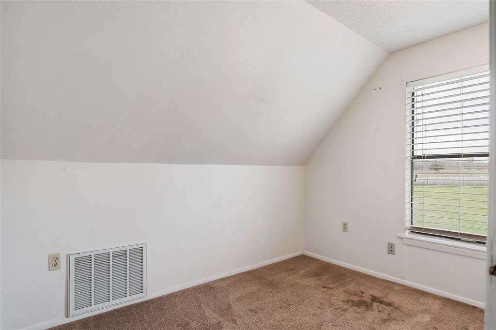 1106 HCR 1414 Covington, TX 76636 - Photo 26 of 38 an empty room with windows