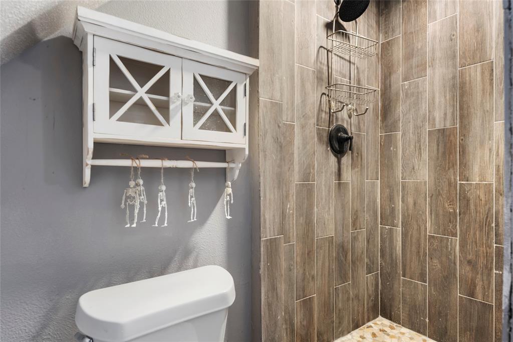 1106 HCR 1414 Covington, TX 76636 - Photo 29 of 38 a bathroom with a toilet and a shower