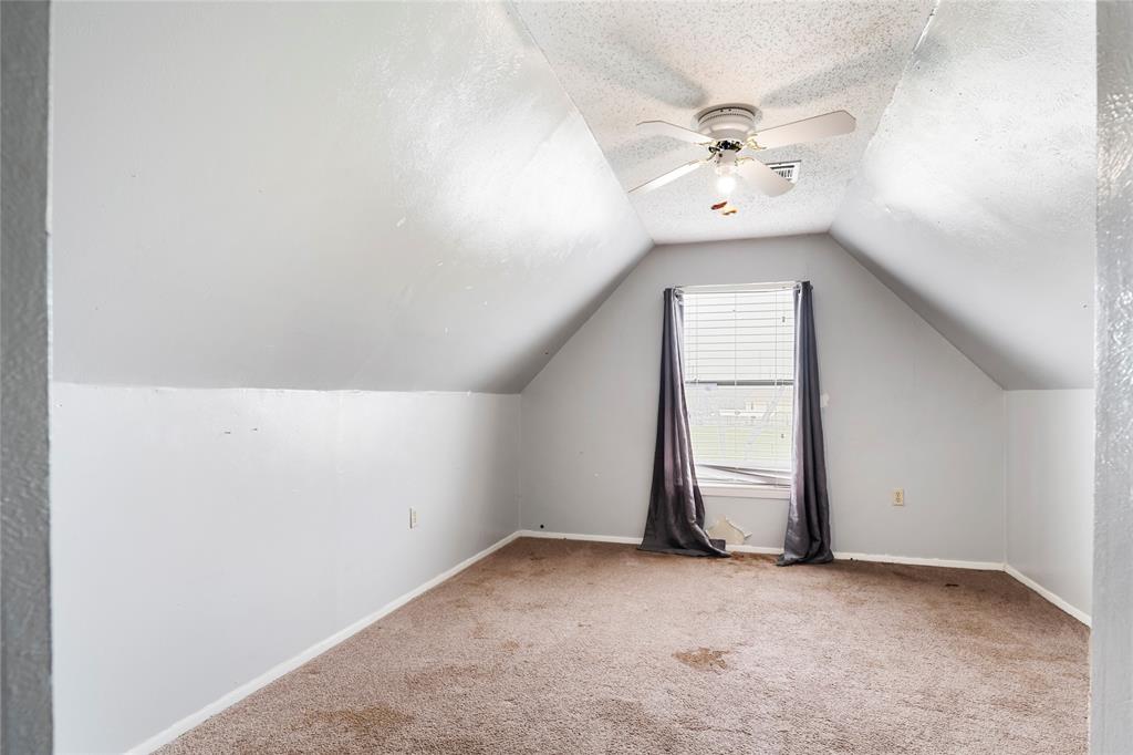 1106 HCR 1414 Covington, TX 76636 - Photo 29 of 37 an empty room with a ceiling fan and window
