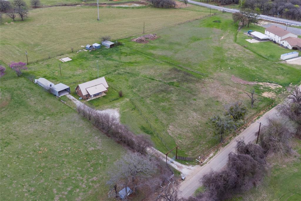 1106 HCR 1414 Covington, TX 76636 - Photo 35 of 38 a backyard of a house with lots of green space