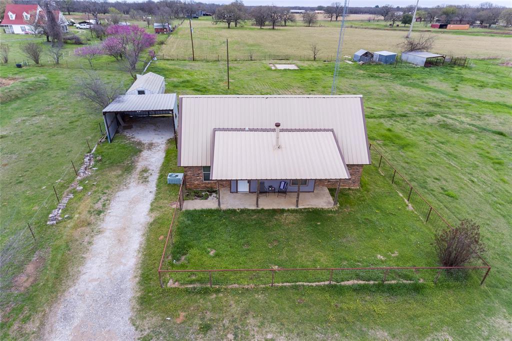 1106 HCR 1414 Covington, TX 76636 - Photo 37 of 37 an aerial view of a house with a yard
