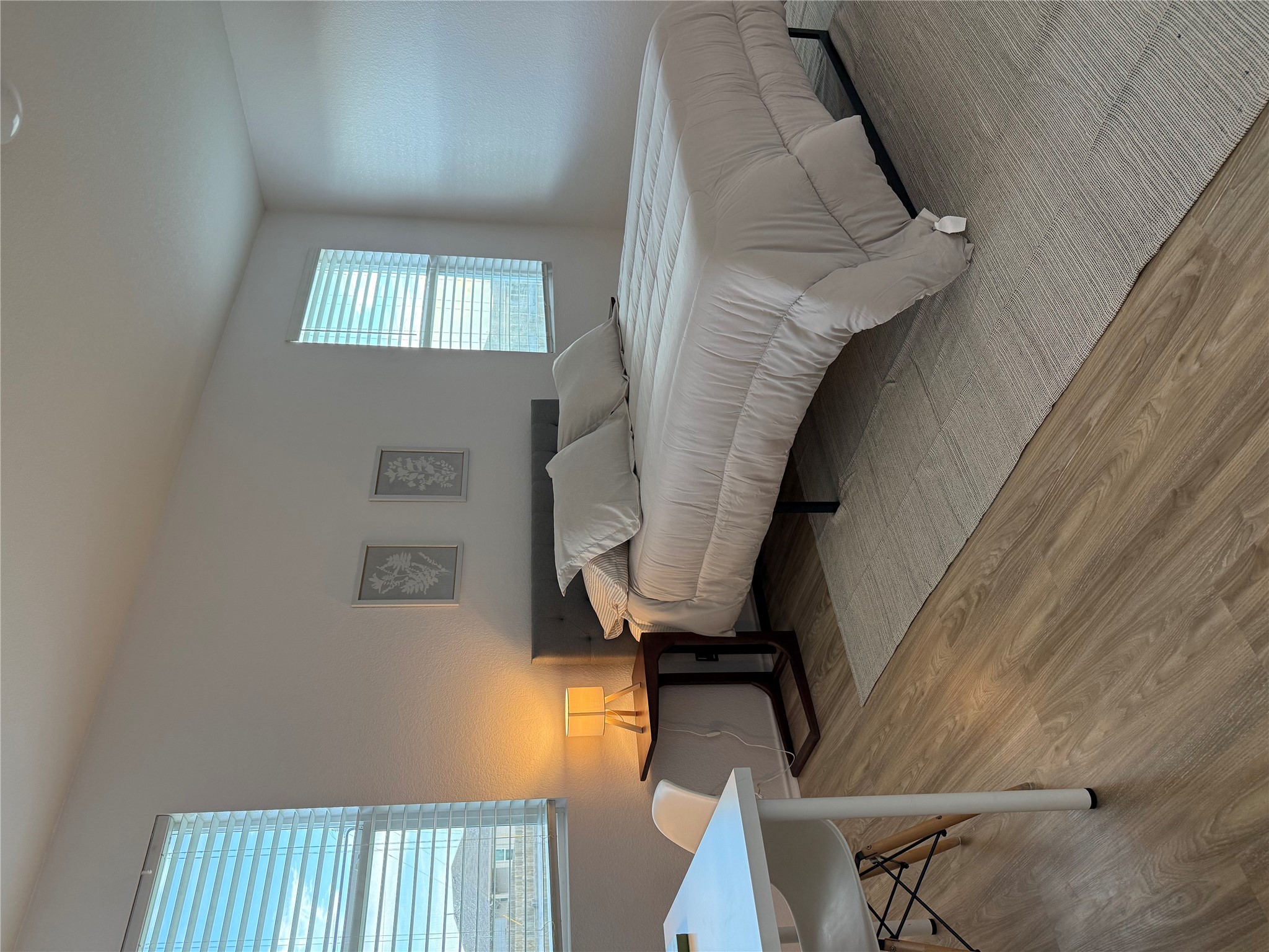 14907 Retha Pass Austin, TX 78725 - Photo 4 of 22 Natural light illuminates the smooth flooring in this comfortable bedroom.