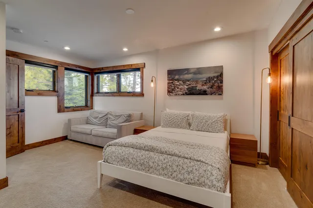 a bathroom with a shower a sink and a mirror