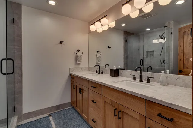a bedroom with furniture and a flat screen tv
