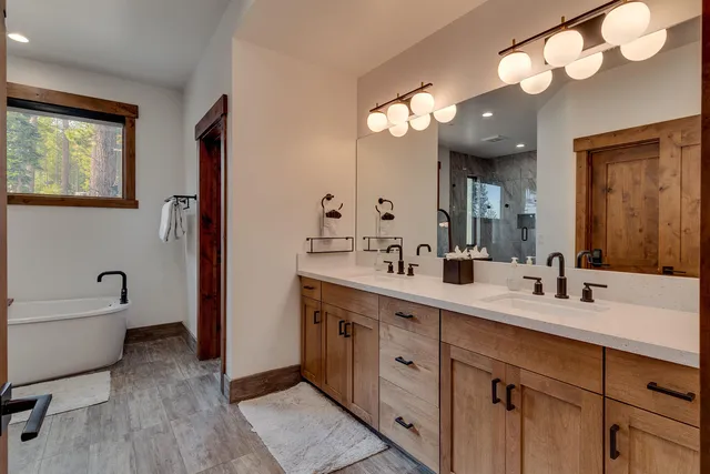 a bathroom with a bathtub and a shower
