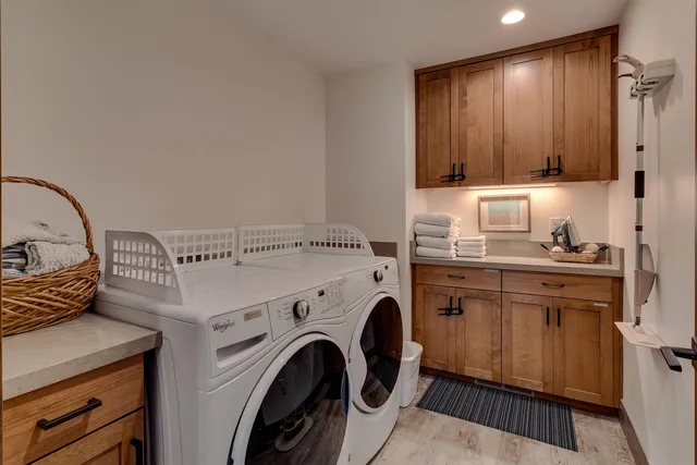 a bedroom with a bed and a wall painting