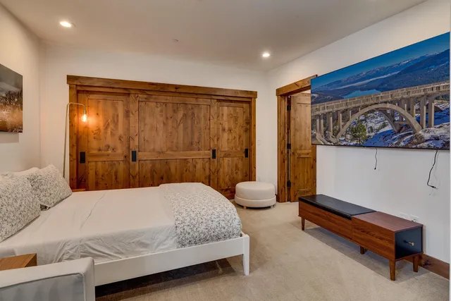 a bedroom with furniture and a window