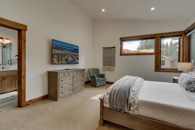a bathroom with a sink mirror and a shower