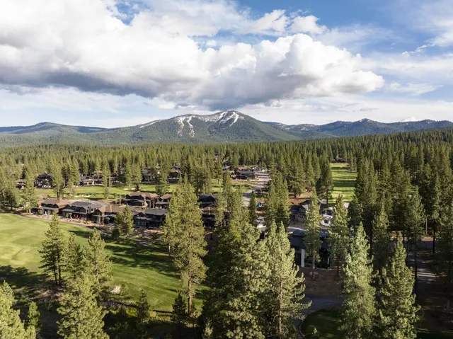a view of a house with a yard and garage