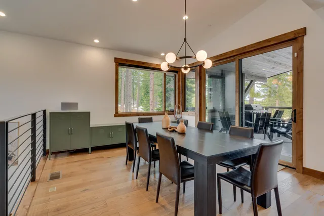 a view of a balcony with chairs and wooden floor