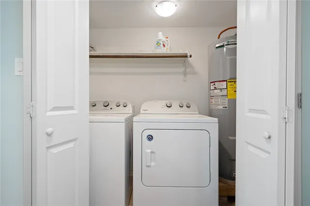 a utility room with dryer and washer