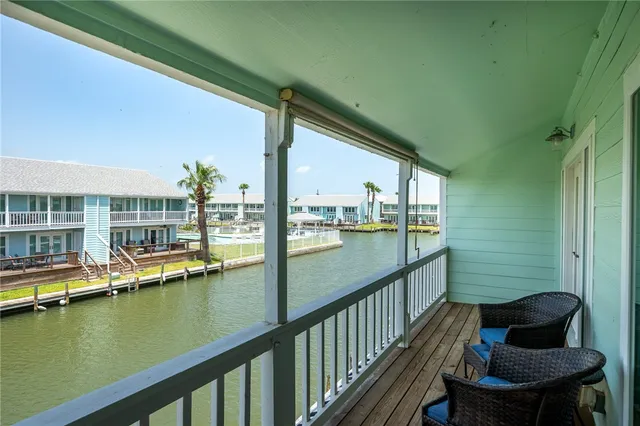 a view of a balcony with chairs