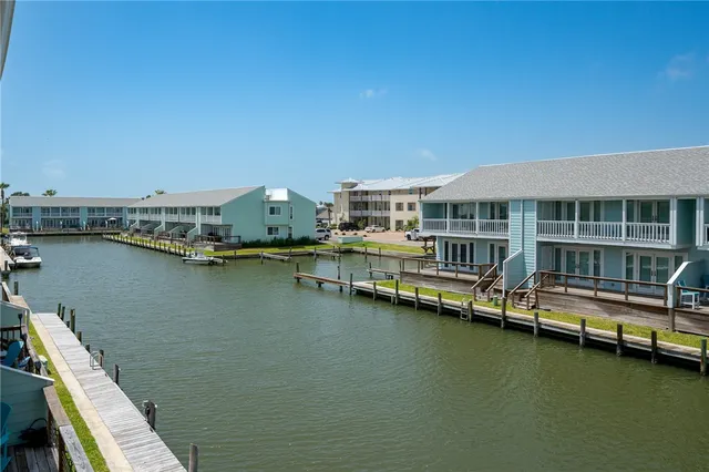 a view of a lake with tall buildings