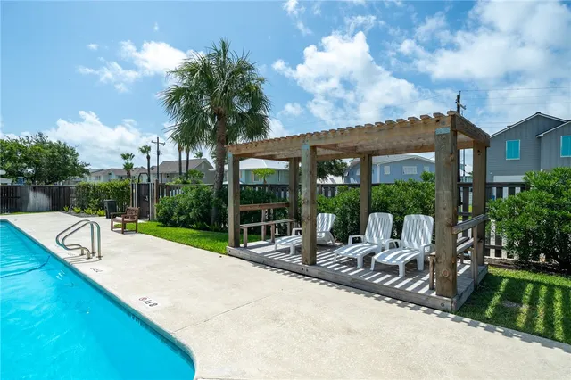 a view of a house with backyard and porch